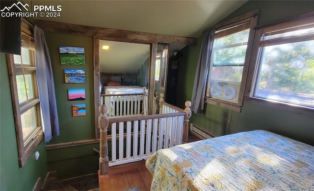 231 Plainview Pl, Manitou Springs, CO 80829 - bedroom with lofted ceiling, baseboard heating, and wood finished floors