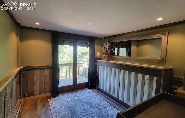 231 Plainview Pl, Manitou Springs, CO 80829 - bar area featuring hardwood / wood-style floors, a baseboard heating unit, a wainscoted wall, recessed lighting, and wood walls