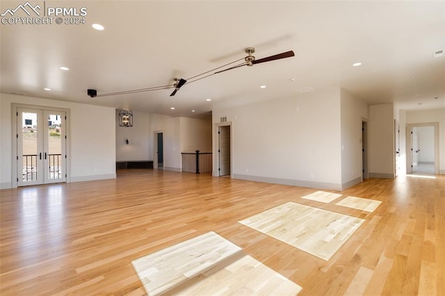 interior space with french doors, light hardwood / wood-style floors, and ceiling fan