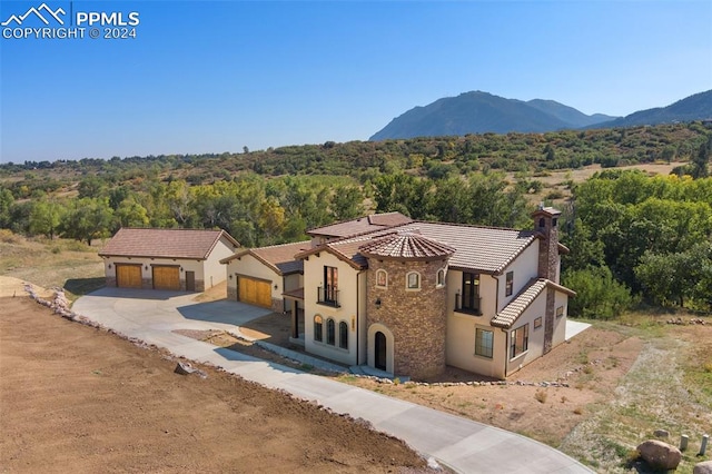 exterior space with a mountain view and a garage