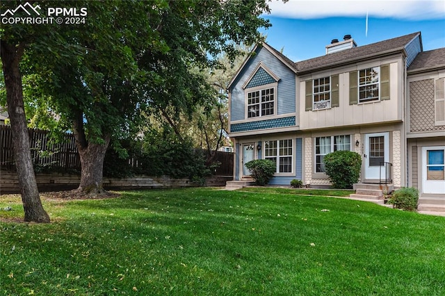 view of front of property with a front lawn