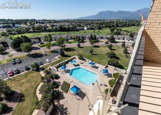 birds eye view of property with a mountain view