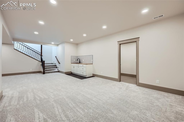 basement with carpet flooring