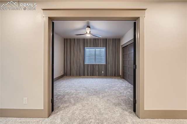 carpeted empty room with ceiling fan