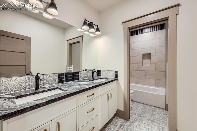 full bathroom with vanity, shower / bath combination, and toilet