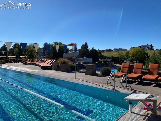 view of swimming pool with a patio