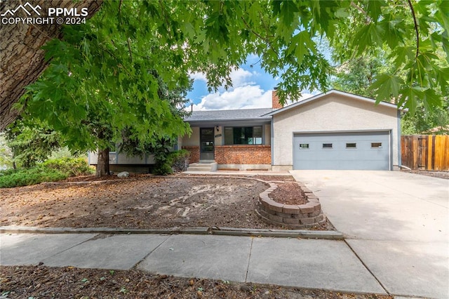 ranch-style house featuring a garage