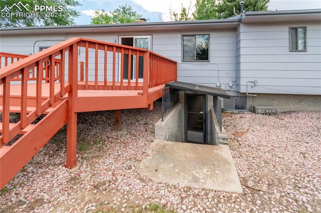 back of property with a wooden deck