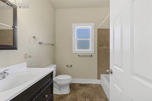 full bathroom featuring tile patterned flooring, vanity, toilet, and tiled shower / bath combo