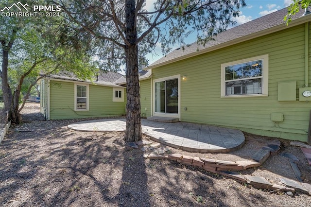 back of property featuring a patio