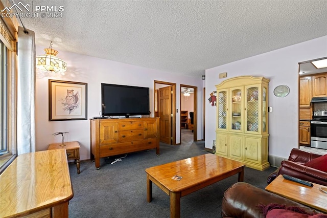 carpeted living room featuring a textured ceiling