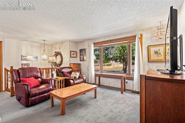 living room with light carpet and a textured ceiling