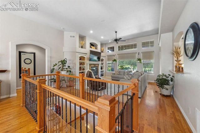 corridor with light hardwood / wood-style flooring