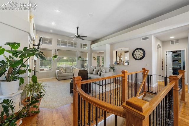 interior space with light hardwood / wood-style floors and ceiling fan