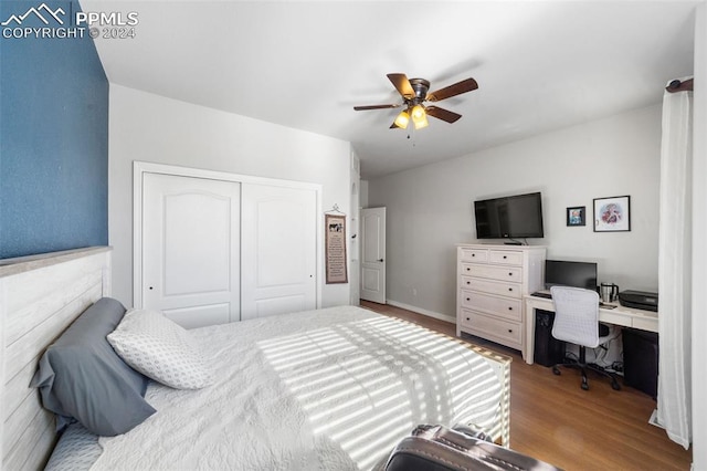 bedroom featuring light hardwood / wood-style floors, a closet, and ceiling fan