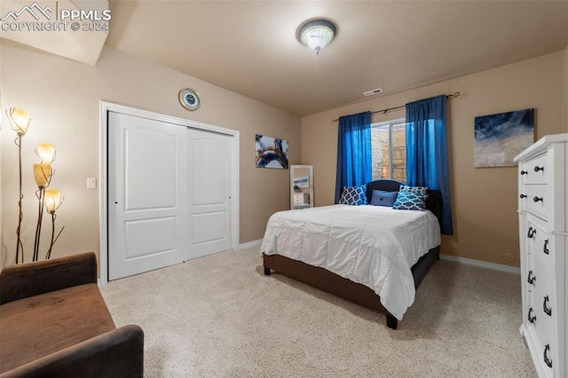 carpeted bedroom featuring a closet