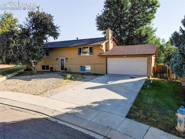 split foyer home featuring a garage