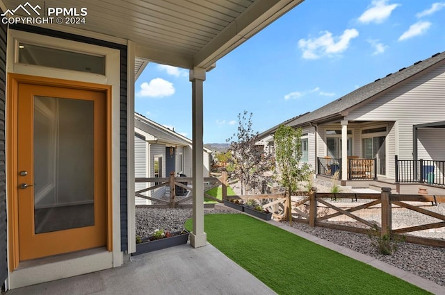 view of yard with covered porch