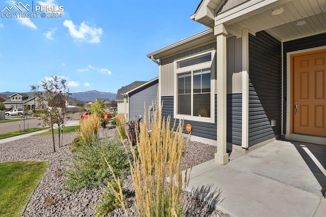 view of home's exterior with a mountain view