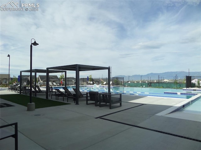 view of community featuring a mountain view and a swimming pool