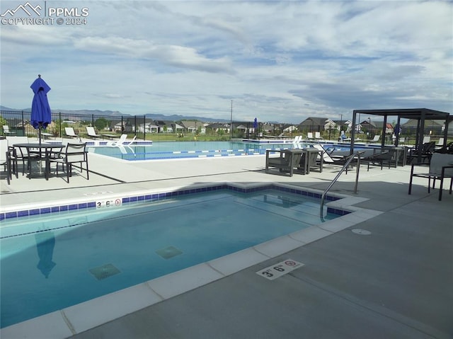 view of swimming pool with a patio area