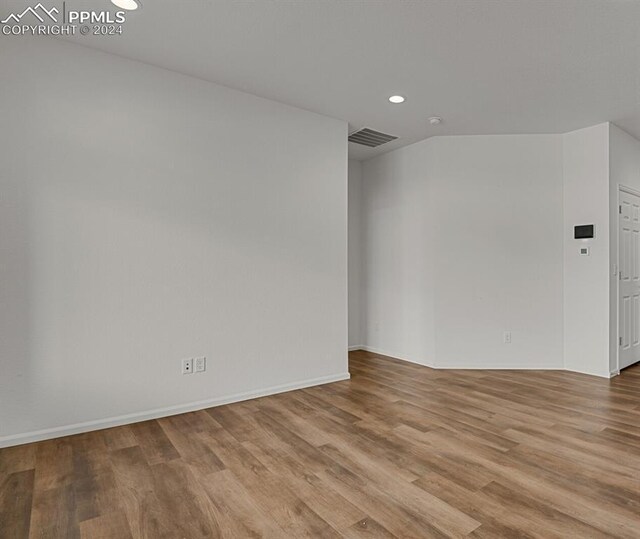 spare room featuring light hardwood / wood-style floors