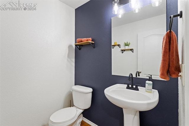 bathroom with sink and toilet