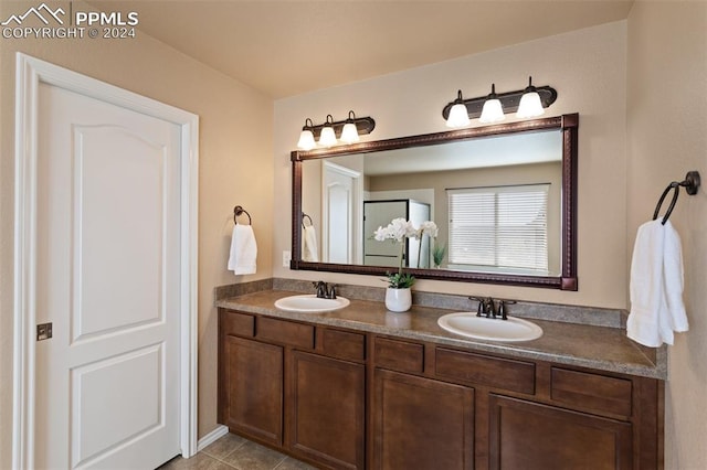 bathroom with tile patterned flooring and vanity