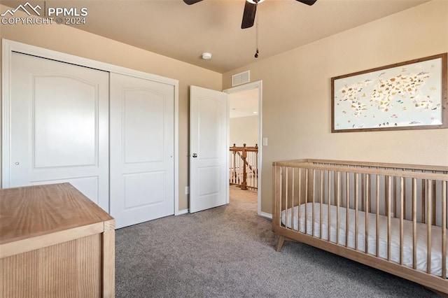 carpeted bedroom featuring ceiling fan and a closet