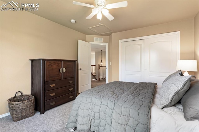 carpeted bedroom with a closet and ceiling fan