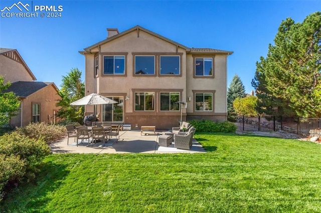 back of house featuring an outdoor hangout area, a yard, and a patio