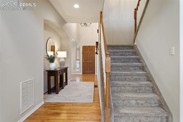 stairway featuring hardwood / wood-style flooring