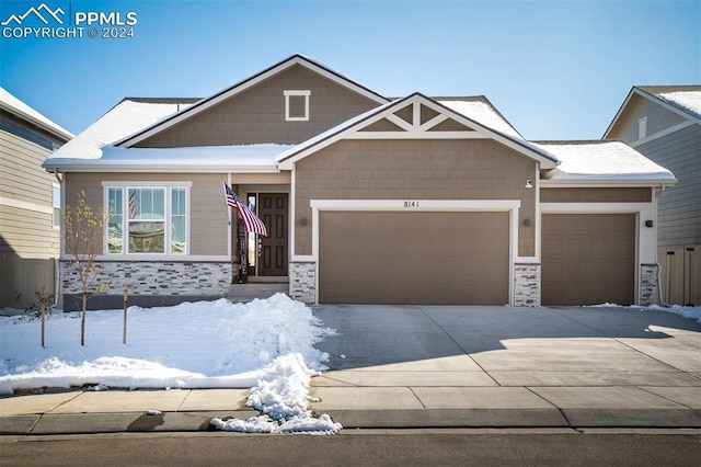 craftsman house with a garage