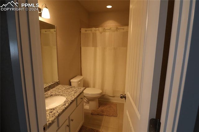 full bathroom featuring tile patterned flooring, vanity, toilet, and shower / bathtub combination with curtain