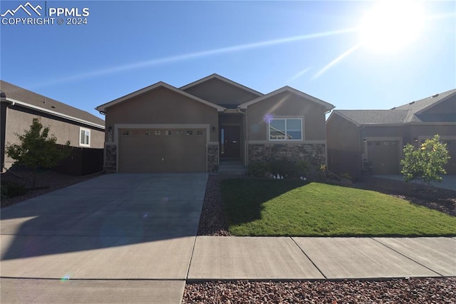 ranch-style house with a front yard and a garage