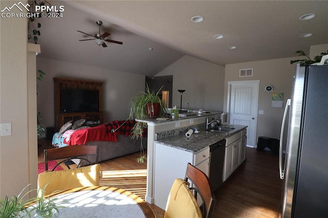 kitchen featuring white cabinets, stainless steel refrigerator, stone countertops, dark hardwood / wood-style flooring, and sink