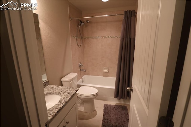 full bathroom featuring shower / tub combo with curtain, tile patterned floors, vanity, and toilet