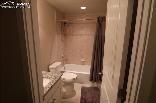 full bathroom with vanity, tile patterned floors, shower / tub combo, and toilet