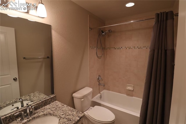 full bathroom featuring vanity, toilet, and shower / bath combo with shower curtain