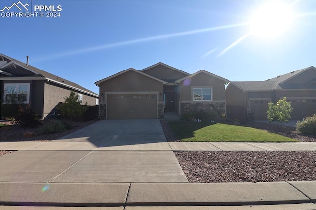 single story home featuring a garage