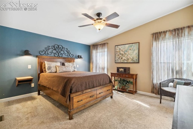 carpeted bedroom featuring lofted ceiling and ceiling fan