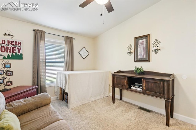 carpeted bedroom with ceiling fan and vaulted ceiling