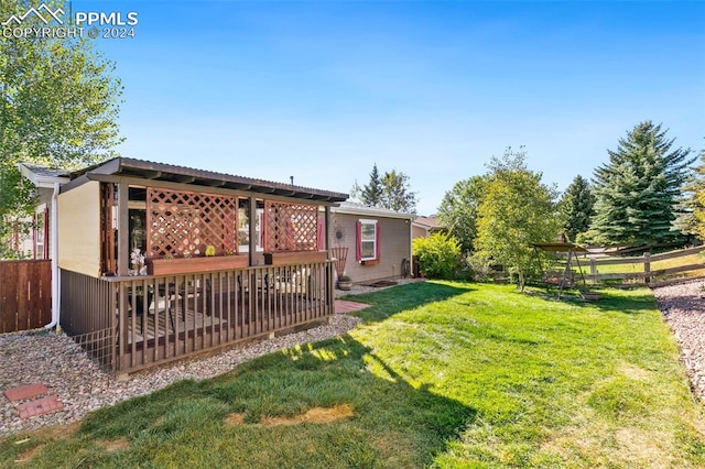 view of yard featuring a wooden deck