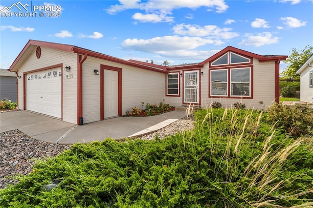 single story home featuring a garage