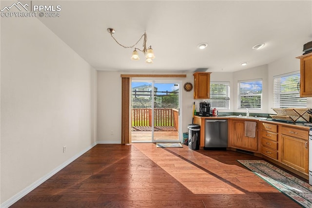 kitchen featuring dark hardwood / wood-style flooring, decorative light fixtures, stainless steel dishwasher, sink, and a notable chandelier