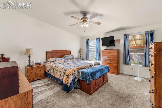 bedroom featuring ceiling fan and light colored carpet