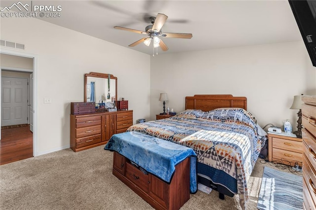 carpeted bedroom with ceiling fan