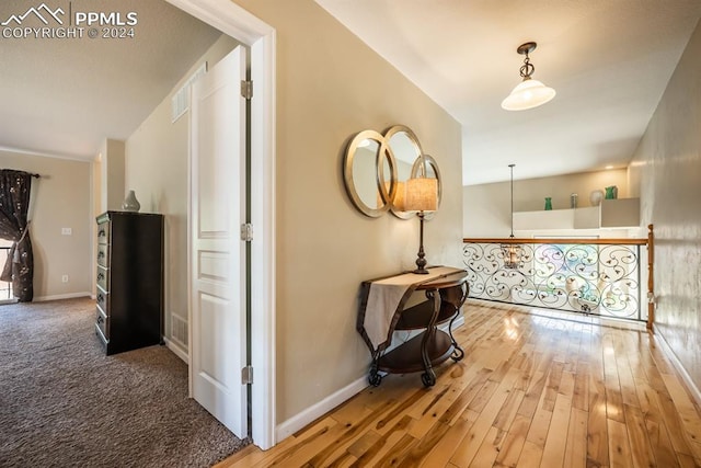 corridor featuring hardwood / wood-style floors