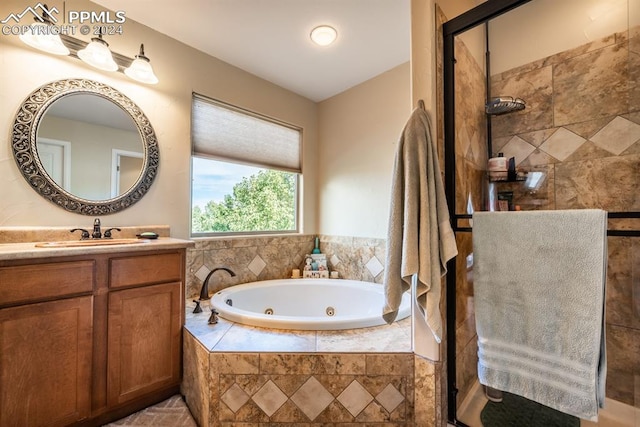 bathroom with plus walk in shower and vanity