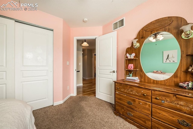 bedroom with carpet floors and a closet